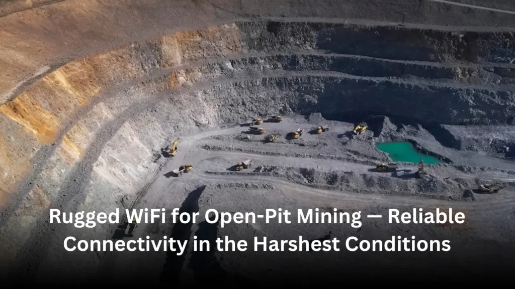 A wide-angle view of an open-pit mine with a large haul truck and a rugged WiFi tower providing connectivity across dusty terrain under clear blue skies.